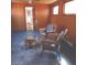 Cozy living room featuring wicker furniture and a decorative rug at 5506 N Drexel Ave, Indianapolis, IN 46220