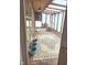 Bright sunroom featuring a brick floor, ceiling fan, and natural light at 5506 N Drexel Ave, Indianapolis, IN 46220