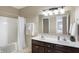 Bathroom featuring double sinks, a tub/shower combo, and neutral colors at 660 Overcup St, Westfield, IN 46074