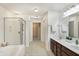 Bathroom featuring a soaking tub, a separate shower, and a double vanity at 660 Overcup St, Westfield, IN 46074