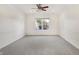 Well-lit bedroom offers plush carpeting, neutral walls, and a view of the outdoors at 660 Overcup St, Westfield, IN 46074