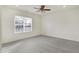 A bright and airy bedroom with plush carpeting, a ceiling fan, and large windows at 660 Overcup St, Westfield, IN 46074