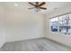 Spacious bedroom features neutral carpeting, a ceiling fan, and a large window at 660 Overcup St, Westfield, IN 46074