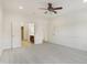 Spacious bedroom featuring plush carpeting, ceiling fan, and adjacent bathroom for added convenience at 660 Overcup St, Westfield, IN 46074