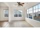 A sunny breakfast nook with large windows, a ceiling fan, and ceramic tile flooring at 660 Overcup St, Westfield, IN 46074