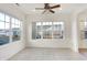 This bright dining nook features many large windows, a ceiling fan, and ceramic tile flooring at 660 Overcup St, Westfield, IN 46074