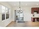 Dining area with hardwood floors, natural light, and a sliding door leading to an outdoor patio at 660 Overcup St, Westfield, IN 46074