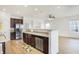 Well-lit kitchen boasting hardwood floors, stainless steel appliances, and ample countertop space at 660 Overcup St, Westfield, IN 46074