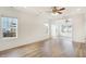 Bright living room with natural light, hardwood floors, and access to adjacent rooms at 660 Overcup St, Westfield, IN 46074