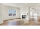 Inviting living room with gas fireplace, hardwood floors, and neutral paint at 660 Overcup St, Westfield, IN 46074