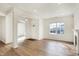 Bright and airy living room with hardwood floors, white trim, and fireplace at 660 Overcup St, Westfield, IN 46074