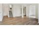 Open concept living room with staircase, hardwood floors, and columns at 660 Overcup St, Westfield, IN 46074