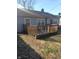 Exterior view of the house highlighting its backyard, satellite, and wooden deck at 732 W 12Th St, Indianapolis, IN 46202