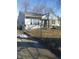 Charming single-story house featuring stone accents and a well-maintained front yard at 732 W 12Th St, Indianapolis, IN 46202