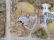 An aerial view showcases the property's layout and manicured surroundings at 7999 Englewood Rd, Indianapolis, IN 46240