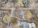 Wide angle aerial view of the house and neighborhood shows privacy and appeal at 7999 Englewood Rd, Indianapolis, IN 46240