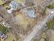Aerial view of the property nestled among trees near other luxury homes at 7999 Englewood Rd, Indianapolis, IN 46240