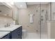 Modern bathroom featuring a single sink, sleek fixtures, and a glass-enclosed shower at 7999 Englewood Rd, Indianapolis, IN 46240