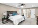 Bedroom with a cozy bed, carpet flooring, and natural lighting at 7999 Englewood Rd, Indianapolis, IN 46240