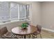 Bright breakfast nook with a round table and large windows at 7999 Englewood Rd, Indianapolis, IN 46240
