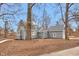 Gray home with new landscaping and walkway on an oversized lot at 7999 Englewood Rd, Indianapolis, IN 46240