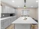 Modern kitchen island featuring a white countertop and stylish seating at 7999 Englewood Rd, Indianapolis, IN 46240