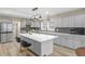 Modern kitchen featuring stainless steel appliances and a large center island at 7999 Englewood Rd, Indianapolis, IN 46240