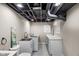 Laundry room featuring a utility sink and modern washer and dryer at 7999 Englewood Rd, Indianapolis, IN 46240