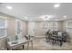 A well-lit living room with a couch, desk, and neutral colors throughout at 7999 Englewood Rd, Indianapolis, IN 46240