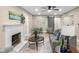 Inviting living room with a fireplace, neutral tones, and plenty of natural light at 7999 Englewood Rd, Indianapolis, IN 46240