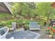 Enjoy the views from the back deck featuring multiple seating areas with lush landscaping at 8150 Foxchase Cir, Indianapolis, IN 46256