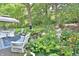 Enjoy the views from the back deck featuring multiple seating areas with lush landscaping at 8150 Foxchase Cir, Indianapolis, IN 46256