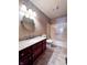 Bathroom featuring single sink vanity, a bath tub, and tile floor at 8150 Foxchase Cir, Indianapolis, IN 46256