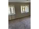Carpeted bedroom with natural light from two windows creates a relaxing space at 8501 Canterbury E Sq, Indianapolis, IN 46260