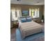 Cozy bedroom with ample natural light, comfortable bed, and soothing color scheme at 8501 Canterbury E Sq, Indianapolis, IN 46260