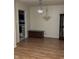 Bright dining area featuring hardwood floors and modern lighting at 8501 Canterbury E Sq, Indianapolis, IN 46260