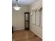 Bright dining area featuring hardwood floors, a large window, and modern lighting at 8501 Canterbury E Sq, Indianapolis, IN 46260