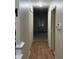 Inviting hallway with hardwood floors and view to carpeted living area at 8501 Canterbury E Sq, Indianapolis, IN 46260