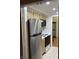 A kitchen featuring stainless steel appliances and wooden cabinets at 8501 Canterbury E Sq, Indianapolis, IN 46260