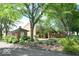 Brick building at the end of a driveway with lots of trees at 8501 Canterbury E Sq, Indianapolis, IN 46260