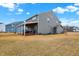 The large backyard features a covered wood porch, ideal for outdoor living and entertaining at 9063 Moyer Pl, Pendleton, IN 46064
