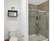 Contemporary bathroom shows tile shower, glass door, toilet and wall decor at 9063 Moyer Pl, Pendleton, IN 46064