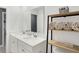 Bathroom featuring double sinks, a large mirror, and a storage shelf at 9063 Moyer Pl, Pendleton, IN 46064