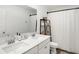 Bathroom featuring double sinks, a large mirror, and a shower with a curtain at 9063 Moyer Pl, Pendleton, IN 46064
