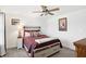 Cozy bedroom with ceiling fan, decorative pillows, and natural light at 9063 Moyer Pl, Pendleton, IN 46064