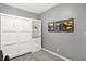 Bedroom featuring a murphy bed, closet, grey walls, and decor at 9063 Moyer Pl, Pendleton, IN 46064