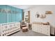 Charming Bedroom with a crib, rocker, dresser, and stylish decor at 9063 Moyer Pl, Pendleton, IN 46064