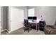 Office space with desk, dual monitors, rolling chair, closet, and reading chair at 9063 Moyer Pl, Pendleton, IN 46064