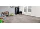 Bonus room features a toy storage system, plush carpet, and natural light at 9063 Moyer Pl, Pendleton, IN 46064