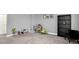Bonus room features a toy storage system, plush carpet, and seating at 9063 Moyer Pl, Pendleton, IN 46064